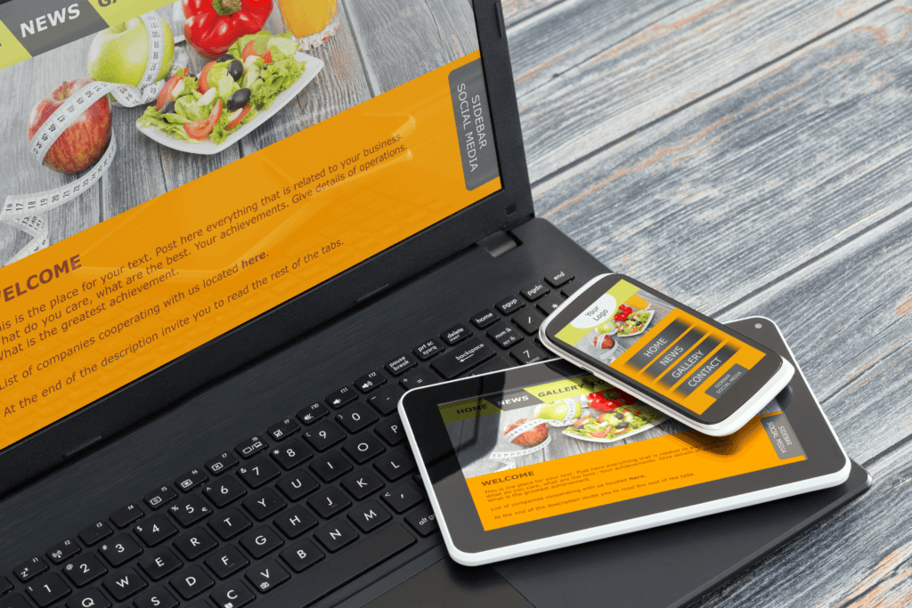 Photo of a modern website on a laptop, tablet, and phone.