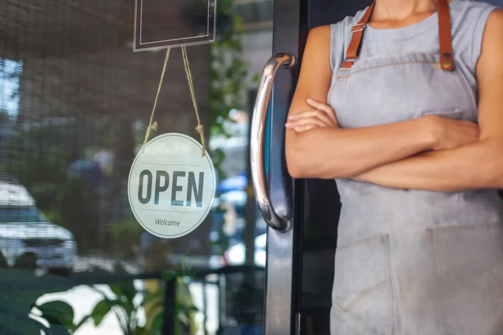 Small business with an Open sign in the window, ready for customers.