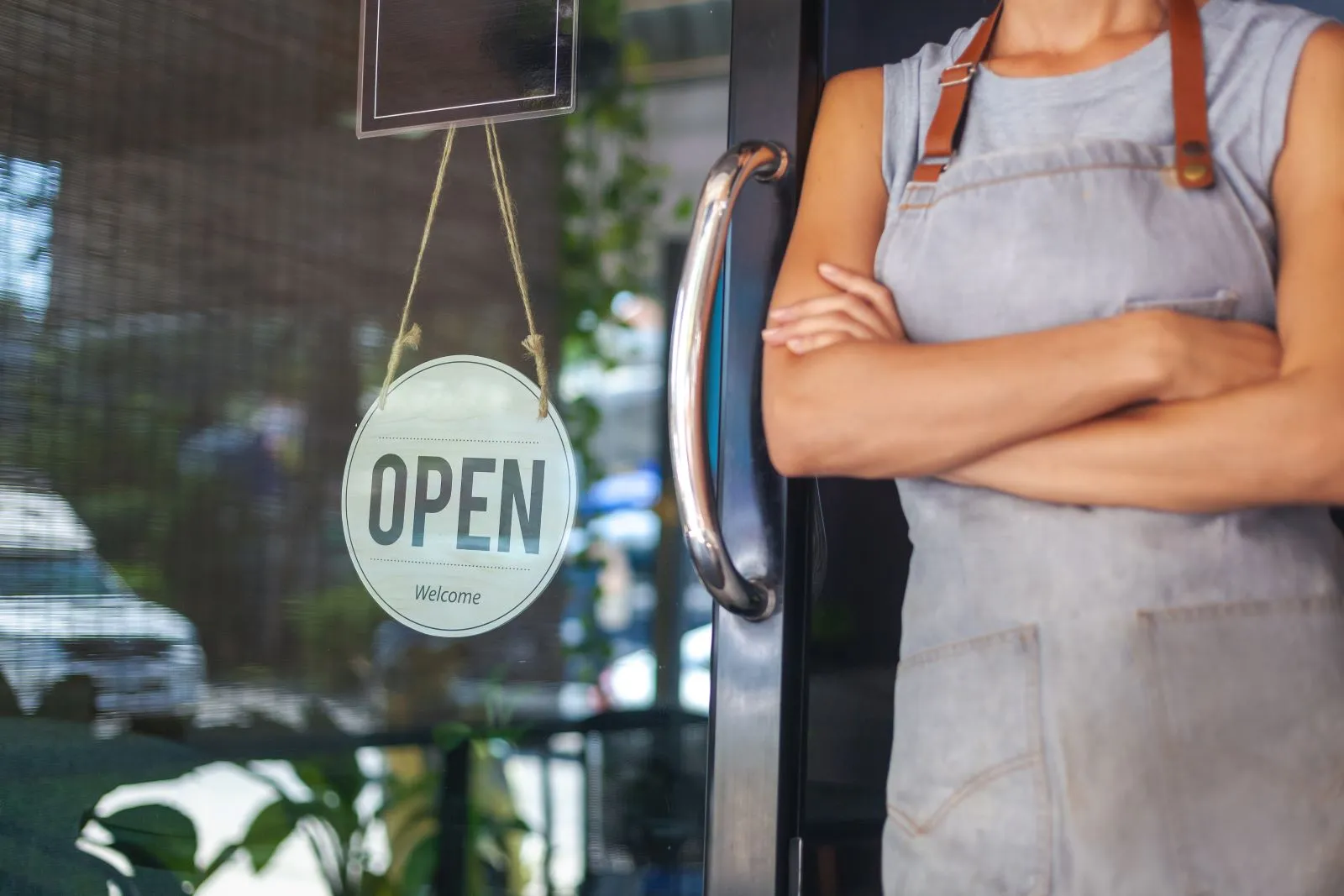Small business with an Open sign in the window, ready for customers.